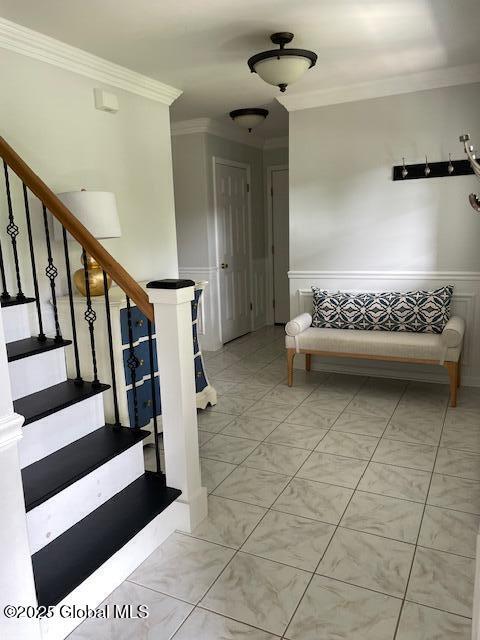 6 Patroon Way, Halfmoon, NY 12065 - staircase featuring crown molding, wainscoting, and a decorative wall