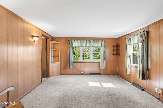 2289 Hickory Hill Rd, Mohawk, NY 12068 - spare room with healthy amount of natural light, carpet floors, and wooden walls