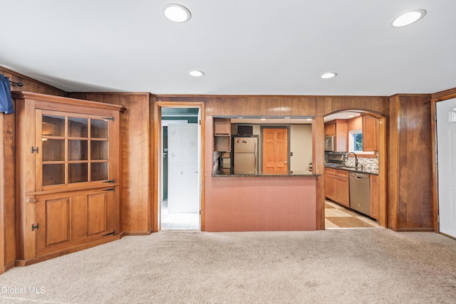 2289 Hickory Hill Rd, Mohawk, NY 12068 - kitchen with stainless steel appliances, light colored carpet, arched walkways, recessed lighting, and dark stone counters