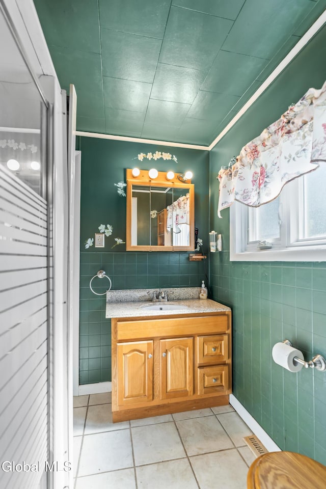 2289 Hickory Hill Rd, Mohawk, NY 12068 - full bath featuring tile walls, vanity, tile patterned flooring, and a shower stall