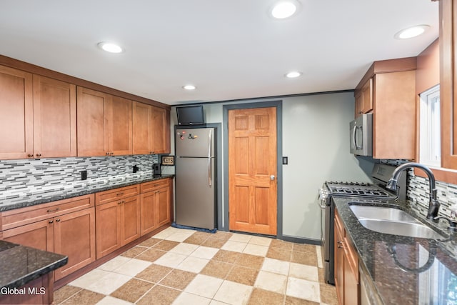 2289 Hickory Hill Rd, Mohawk, NY 12068 - kitchen featuring appliances with stainless steel finishes, backsplash, brown cabinetry, dark stone countertops, and recessed lighting