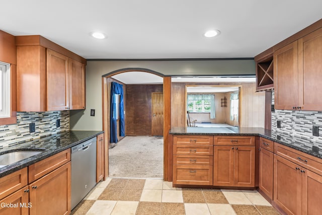 2289 Hickory Hill Rd, Mohawk, NY 12068 - kitchen with dishwasher, brown cabinets, arched walkways, open shelves, and dark stone counters