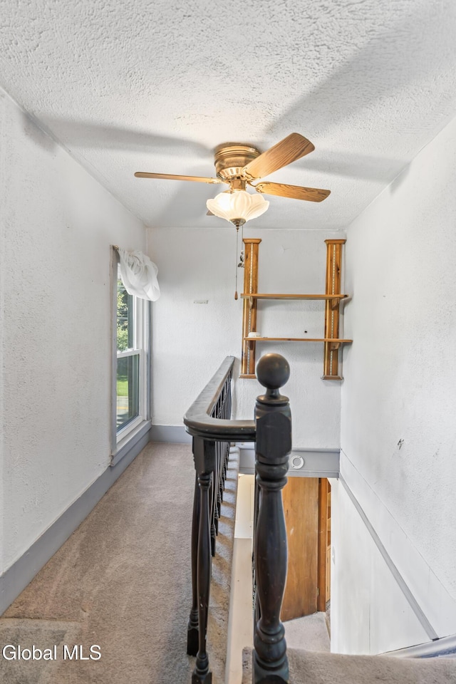 2289 Hickory Hill Rd, Mohawk, NY 12068 - stairs featuring carpet flooring, a textured ceiling, ceiling fan, and a textured wall