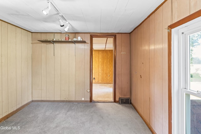 2289 Hickory Hill Rd, Mohawk, NY 12068 - spare room with carpet flooring, wood walls, and rail lighting