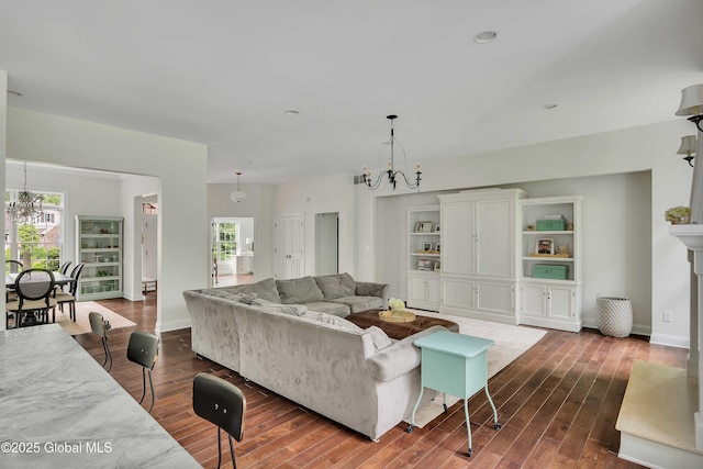 13 Bridlewood Loop, Clifton Park, NY 12148 - living area with a chandelier and dark wood-type flooring