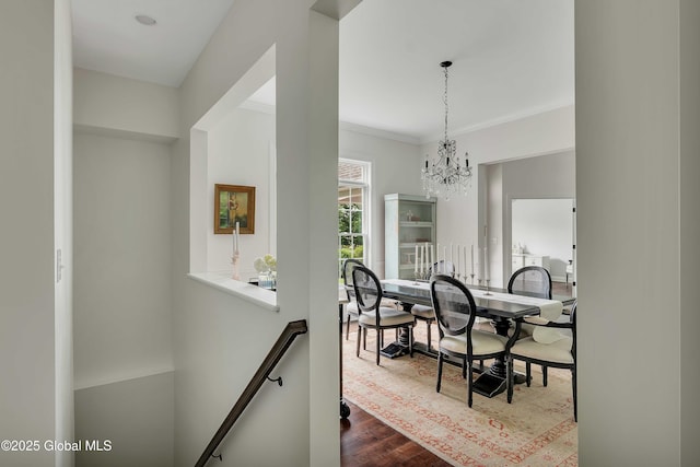 13 Bridlewood Loop, Clifton Park, NY 12148 - hall featuring a chandelier, dark wood finished floors, crown molding, and an upstairs landing