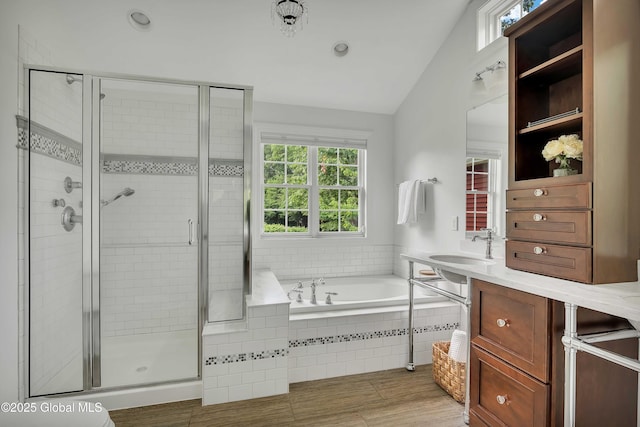13 Bridlewood Loop, Clifton Park, NY 12148 - bathroom featuring a bath, lofted ceiling, a shower stall, and recessed lighting