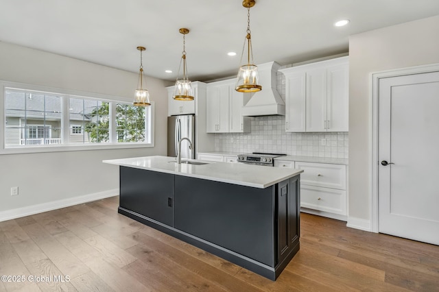 606 Vly Pointe Dr, Niskayuna, NY 12309 - kitchen with custom exhaust hood, stainless steel appliances, white cabinetry, backsplash, and light countertops