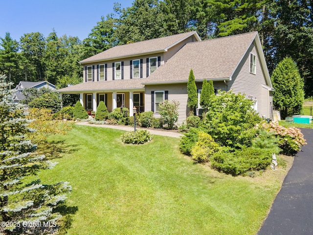 13 Macory Way, Moreau, NY 12831 - colonial house with a front yard, roof with shingles, and view of scattered trees