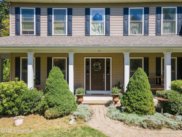 13 Macory Way, Moreau, NY 12831 - view of front of house featuring a porch and roof with shingles