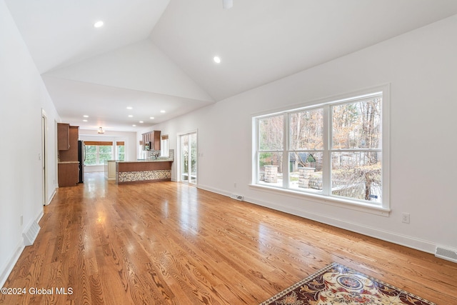 13 Macory Way, Moreau, NY 12831 - unfurnished living room with light wood finished floors, recessed lighting, and high vaulted ceiling