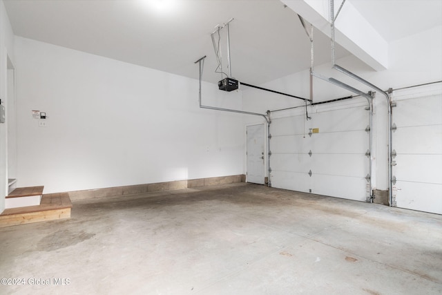 13 Macory Way, Moreau, NY 12831 - garage featuring a garage door opener