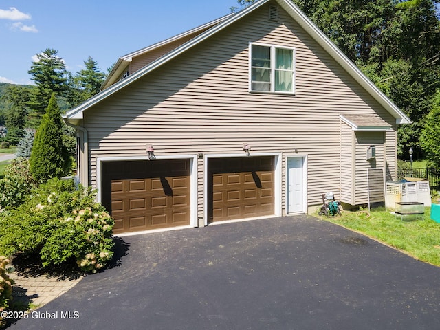 13 Macory Way, Moreau, NY 12831 - view of side of property featuring driveway and a garage