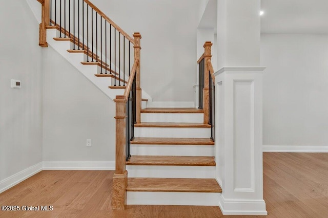 602 Vly Pointe Dr, Niskayuna, NY 12309 - staircase with wood finished floors and baseboards