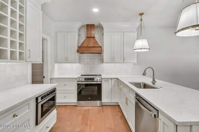 602 Vly Pointe Dr, Niskayuna, NY 12309 - kitchen featuring stainless steel appliances, premium range hood, tasteful backsplash, a peninsula, and recessed lighting