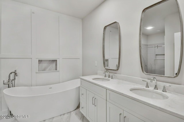 602 Vly Pointe Dr, Niskayuna, NY 12309 - bathroom featuring double vanity, a freestanding tub, and marble finish flooring