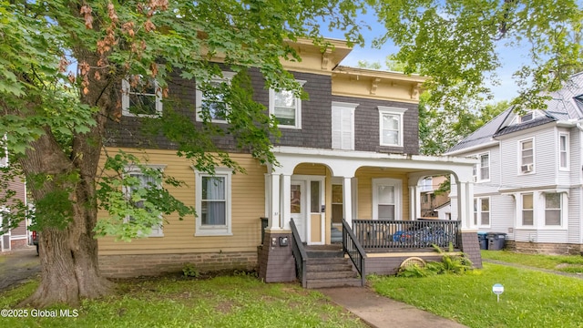 31 Cedar St, Oneonta, NY 13820 - italianate house with a porch and a front lawn