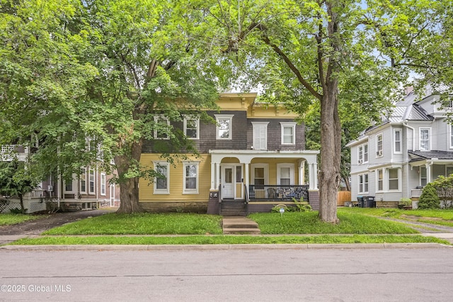 31 Cedar St, Oneonta, NY 13820 - view of front of property with a porch and a front lawn