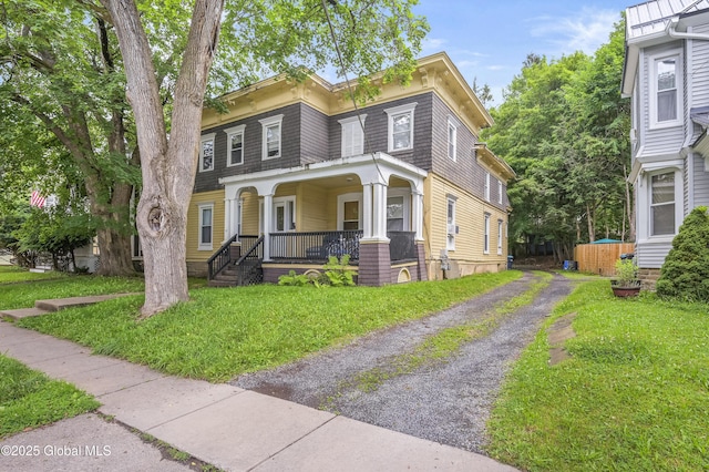 31 Cedar St, Oneonta, NY 13820 - italianate-style house featuring covered porch, driveway, and a front yard