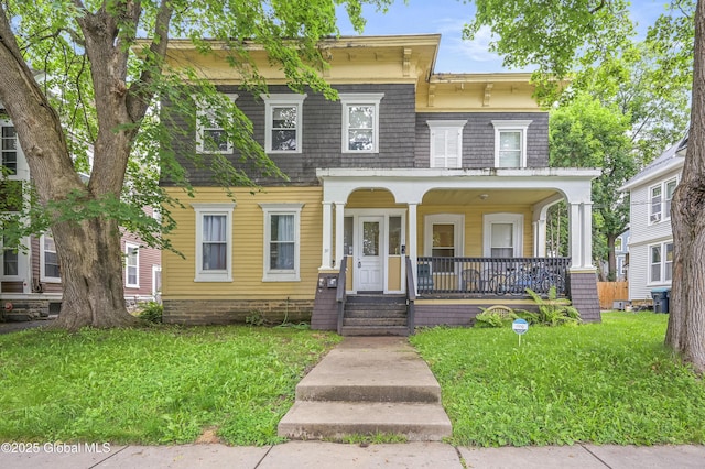 31 Cedar St, Oneonta, NY 13820 - italianate home featuring a porch and a front lawn