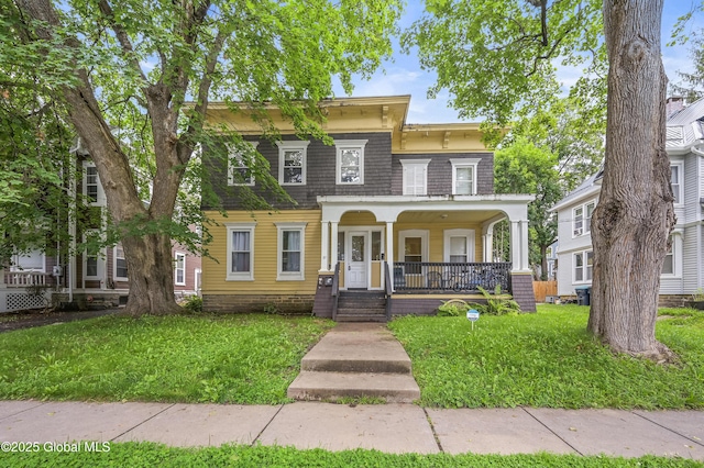 31 Cedar St, Oneonta, NY 13820 - italianate home featuring covered porch and a front lawn