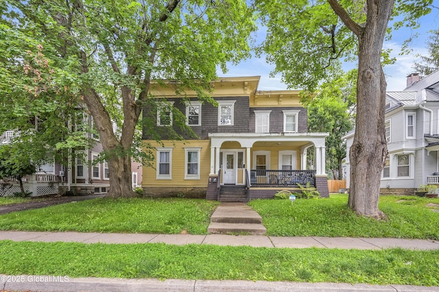 31 Cedar St, Oneonta, NY 13820 - italianate house featuring a porch and a front lawn