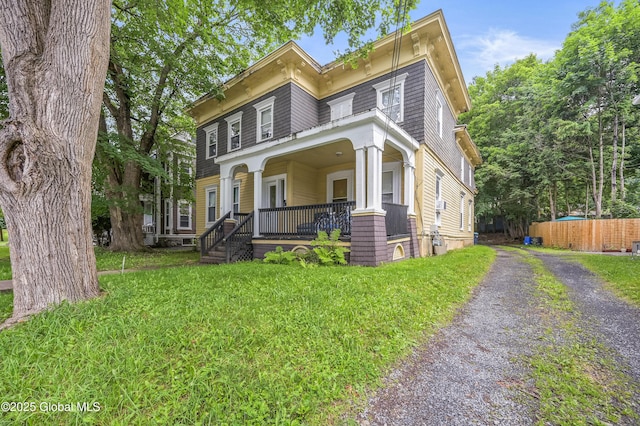 31 Cedar St, Oneonta, NY 13820 - italianate house with covered porch and a front lawn