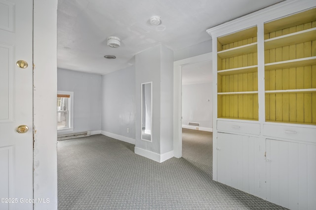 31 Cedar St, Oneonta, NY 13820 - unfurnished room featuring carpet, a smoke detector, and a baseboard heating unit