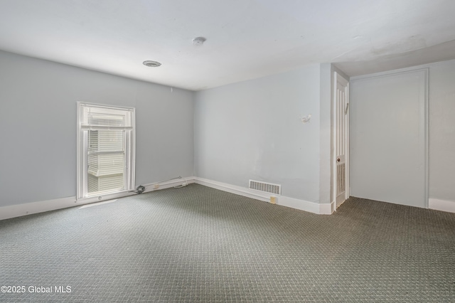 31 Cedar St, Oneonta, NY 13820 - carpeted empty room with a smoke detector and baseboards