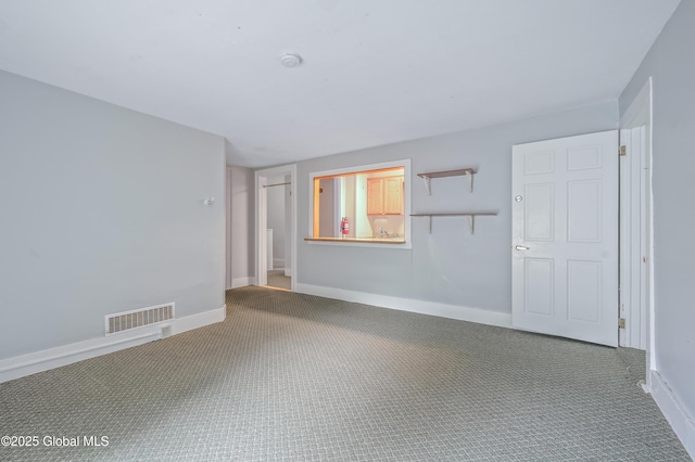 31 Cedar St, Oneonta, NY 13820 - carpeted empty room featuring baseboards