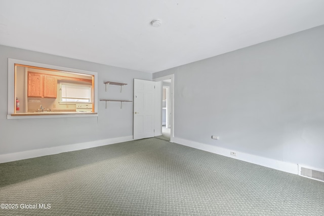31 Cedar St, Oneonta, NY 13820 - spare room featuring carpet floors and a smoke detector