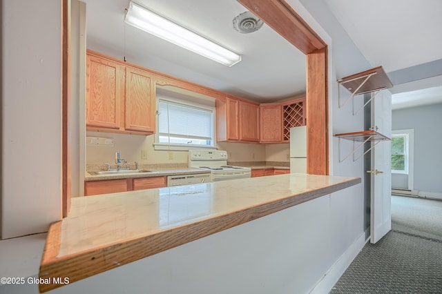 31 Cedar St, Oneonta, NY 13820 - kitchen with white appliances, light brown cabinets, healthy amount of natural light, and a baseboard radiator