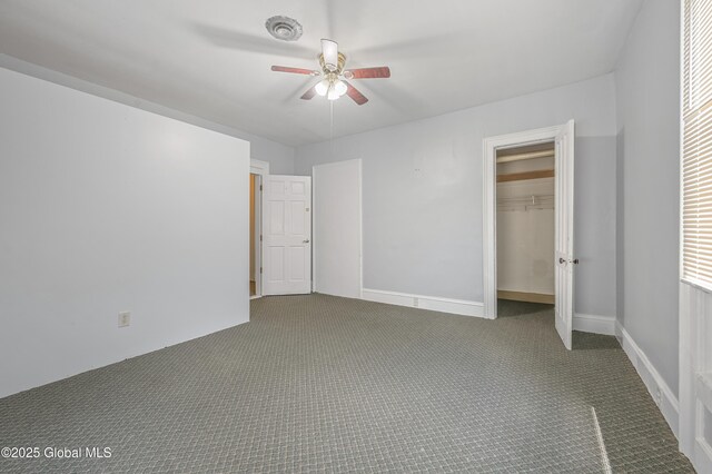 31 Cedar St, Oneonta, NY 13820 - unfurnished bedroom featuring carpet floors, a closet, and a ceiling fan