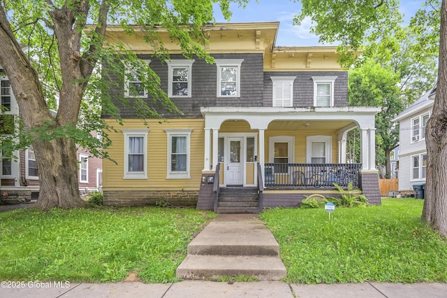 31 Cedar St, Oneonta, NY 13820 - view of front facade with covered porch and a front yard