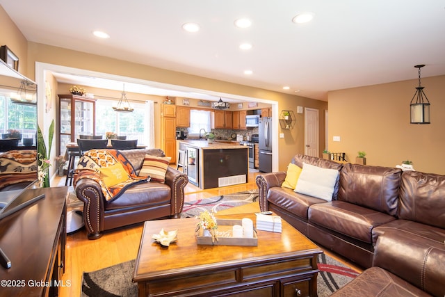 99 Fiddlers Ln, Colonie, NY 12110 - living room with light wood-type flooring, recessed lighting, and wine cooler