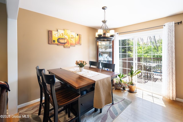 99 Fiddlers Ln, Colonie, NY 12110 - dining area featuring a chandelier and wood finished floors