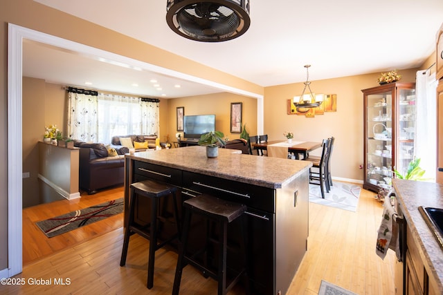 99 Fiddlers Ln, Colonie, NY 12110 - kitchen featuring a center island, a chandelier, light wood finished floors, pendant lighting, and recessed lighting