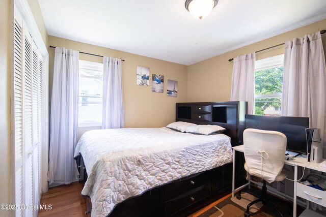 99 Fiddlers Ln, Colonie, NY 12110 - bedroom with wood finished floors and an office area