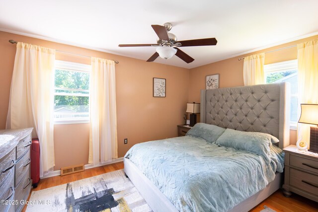 99 Fiddlers Ln, Colonie, NY 12110 - bedroom featuring light wood finished floors and ceiling fan
