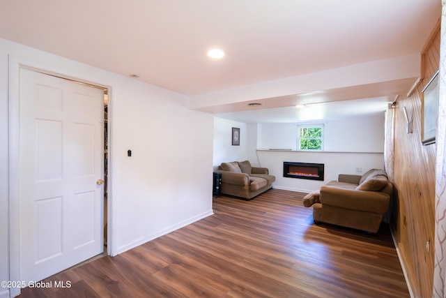 99 Fiddlers Ln, Colonie, NY 12110 - living room with a glass covered fireplace, wood finished floors, and recessed lighting