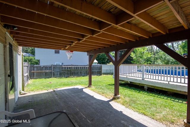 99 Fiddlers Ln, Colonie, NY 12110 - fenced backyard featuring a patio area and a swimming pool