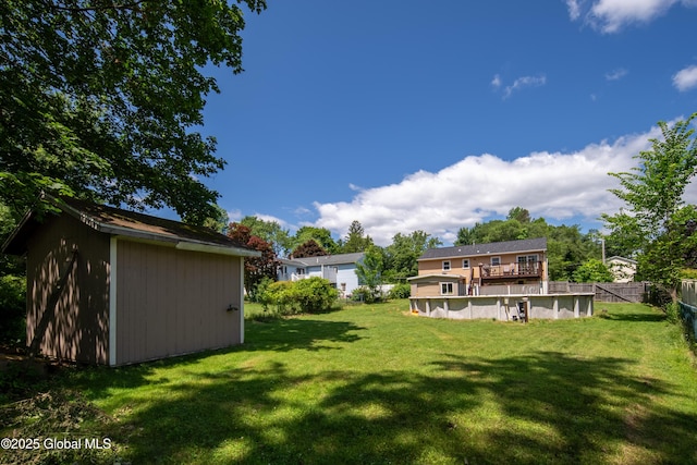 99 Fiddlers Ln, Colonie, NY 12110 - view of yard featuring a storage unit and a deck