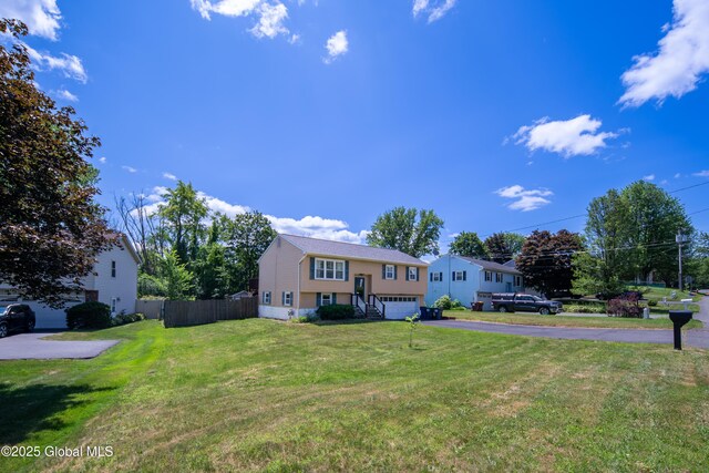 99 Fiddlers Ln, Colonie, NY 12110 - raised ranch featuring asphalt driveway and a garage