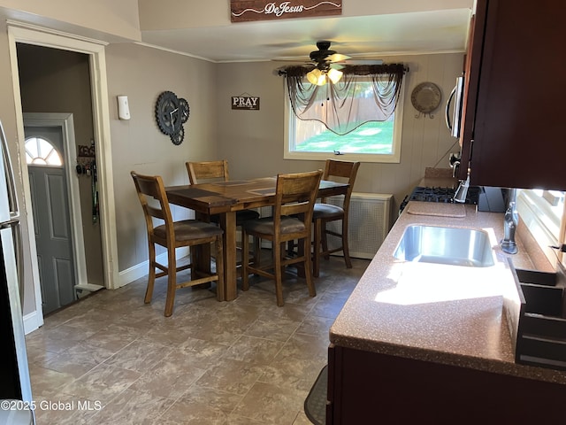 56 Pershing Dr, Scotia, NY 12302 - dining room featuring a ceiling fan and baseboards