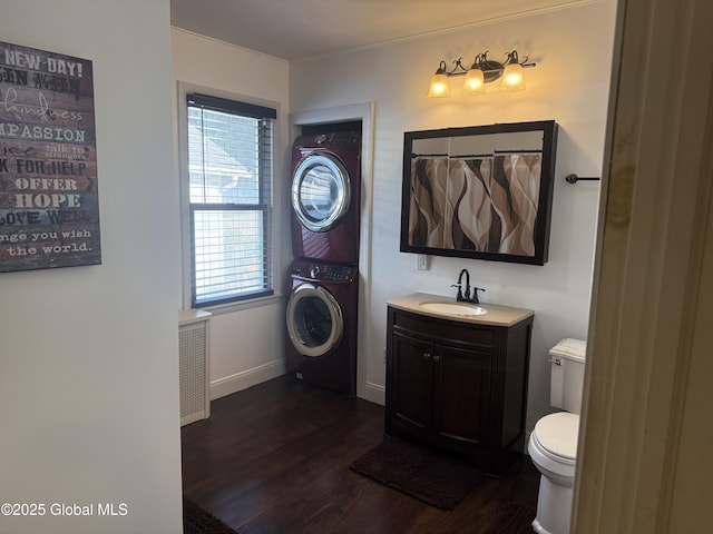 56 Pershing Dr, Scotia, NY 12302 - bathroom with stacked washer / dryer, wood finished floors, and vanity