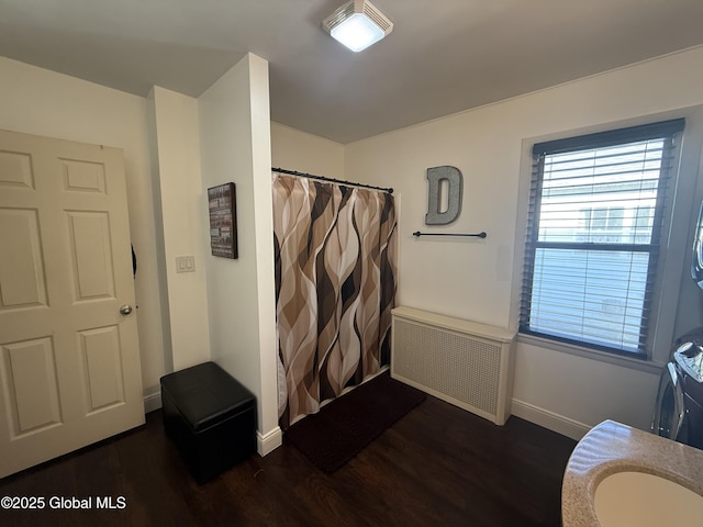 56 Pershing Dr, Scotia, NY 12302 - full bathroom with radiator, wood finished floors, and curtained shower