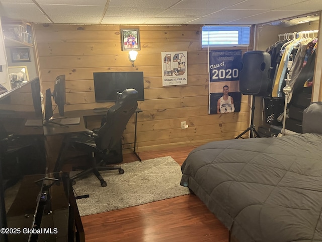 56 Pershing Dr, Scotia, NY 12302 - bedroom featuring wood finished floors, a drop ceiling, and wooden walls