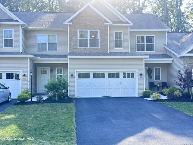 30B Idared Ln, Halfmoon, NY 12065 - craftsman inspired home with an attached garage, driveway, a front lawn, and a shingled roof