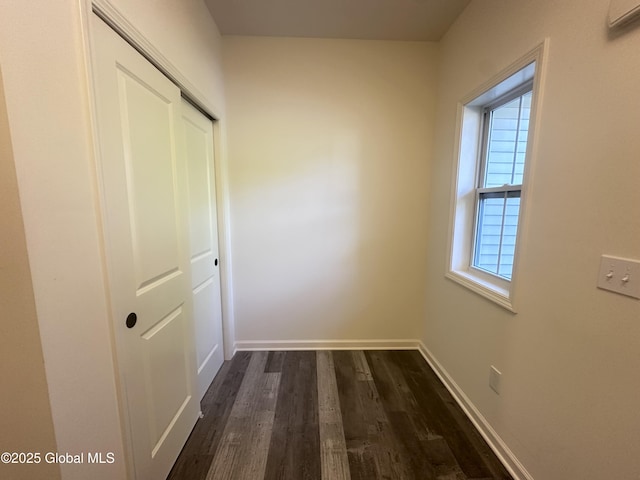 30B Idared Ln, Halfmoon, NY 12065 - unfurnished bedroom with a closet, dark wood-style floors, and a wall mounted AC