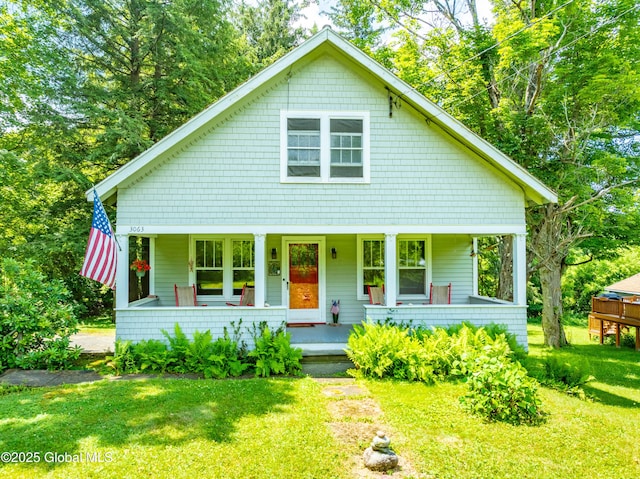 3063 Ny Highway 43, Sand Lake, NY 12018 - view of front facade with a porch and a front lawn